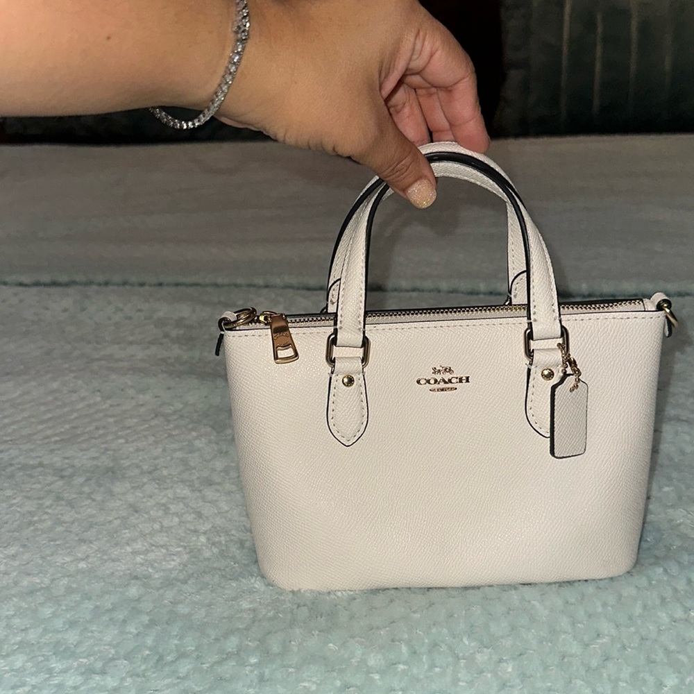 Tiny white coach tote